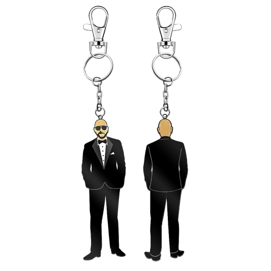 Keychains featuring Pitbull in a black tuxedo, one shown from the front and the other from the back, each attached to a silver lobster clasp and split ring.